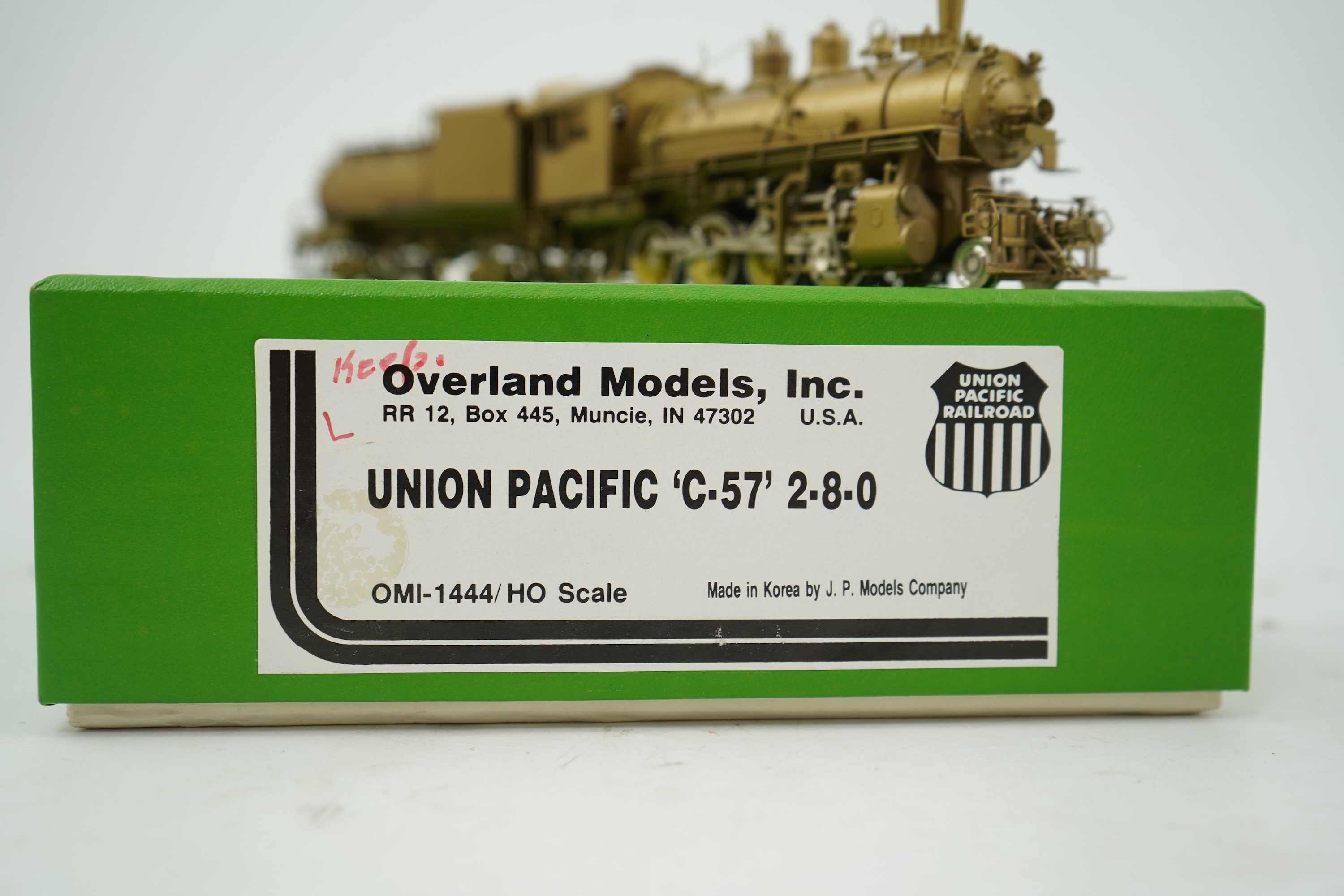 A boxed HO gauge Overland Models Inc. J.P.M. unpainted brass model of Union Pacific Railway C-57, 2-8-0 locomotive with bogie tender, powered for two rail operation.